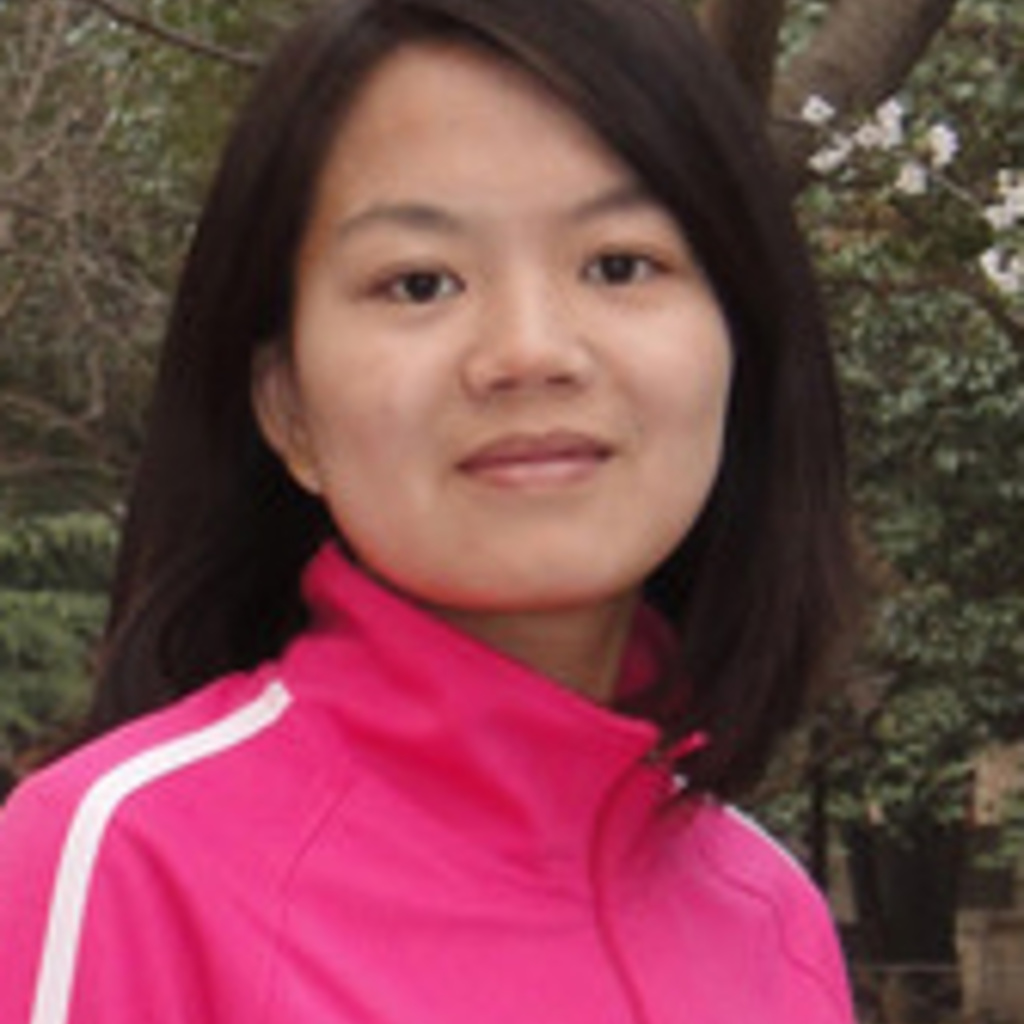 A young woman smiles at the camera