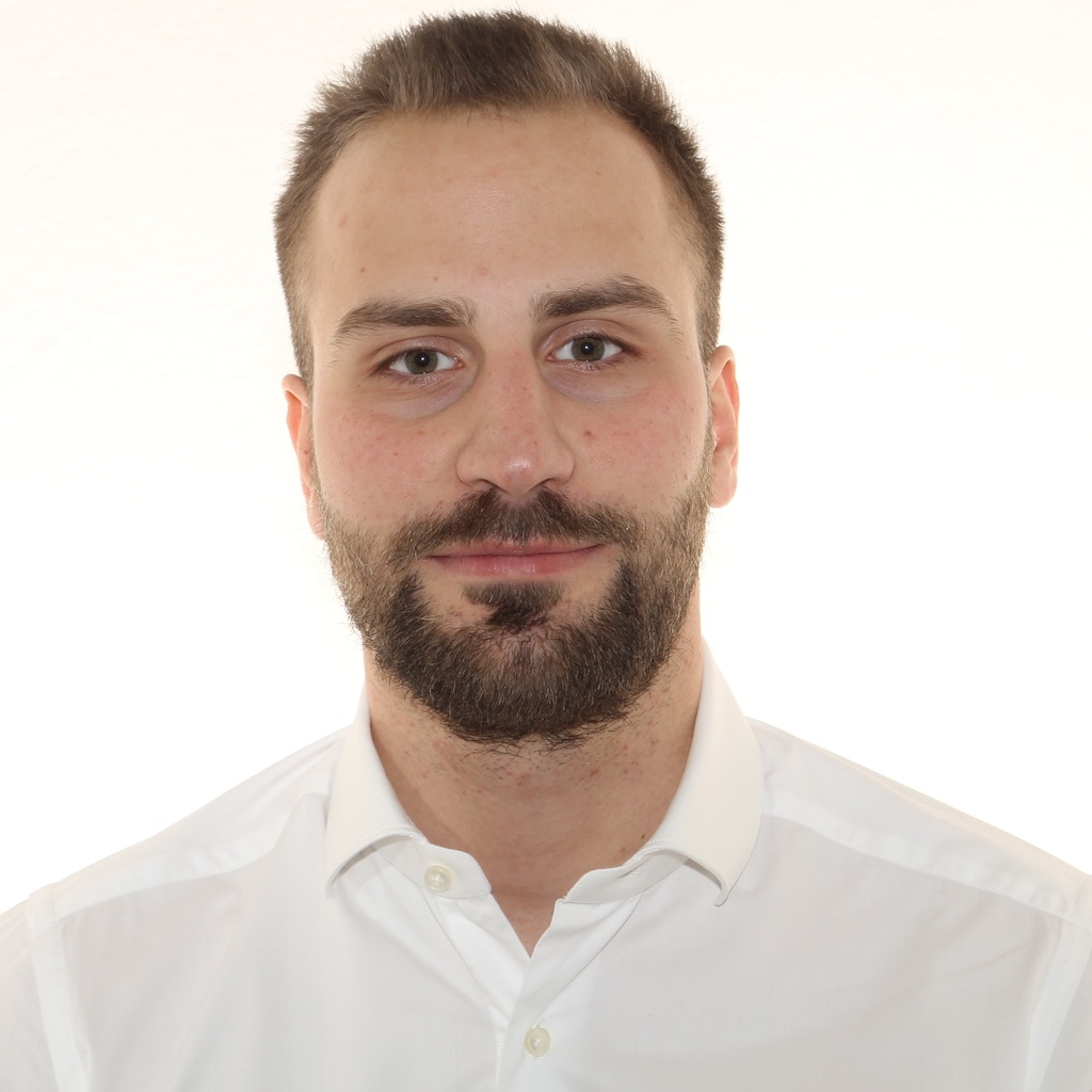 Professional headshot of a young man